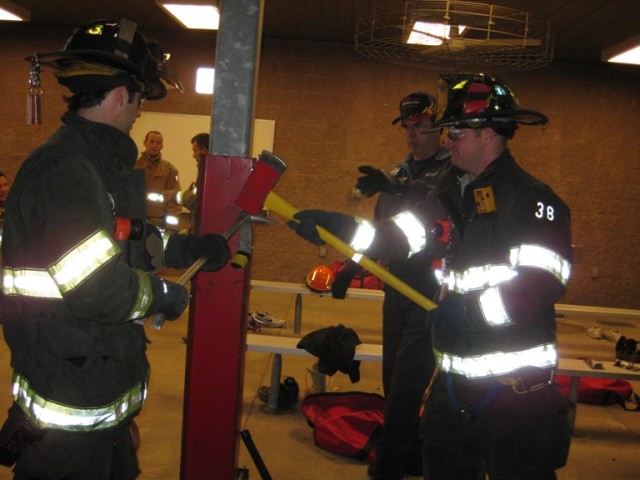 FF/EMT Bennett and FF/EMT Geary use the &quot;irons&quot; at a forcible entry drill at the Somerset County Fire Academy October 20, 2008.